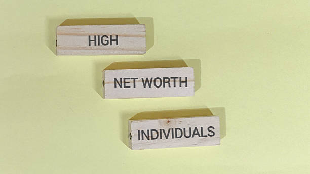 istock High net worth individuals concept displayed using stacked wooden blocks spelling out the phrase against a pale yellow background 2252145899