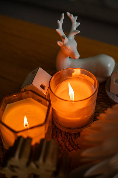 Festive home decor. Christmas tree, burning candles. New Year. Winter.