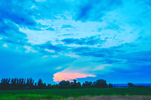 istock Dramatic sunset clouds paint the sky with vibrant colors over a rural landscape 2252150000
