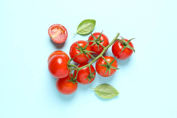 istock Fresh red tomatoes on color background, top view 2252150720