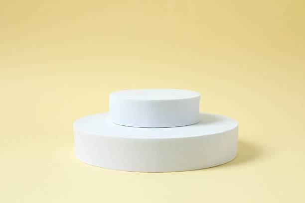 istock White podiums on color background 2252151328