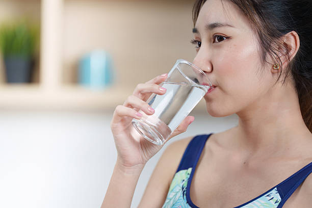 istock Hydration. Woman drinking water, emphasizing importance of hydration in wellness. 2252151486