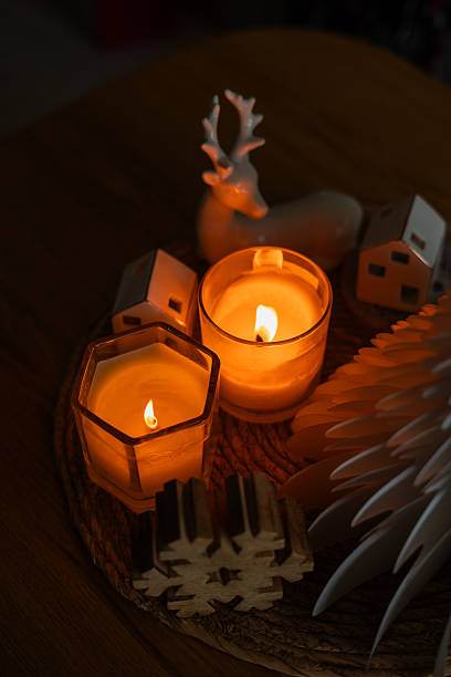Festive home decor. Christmas tree, burning candles. New Year. Winter.