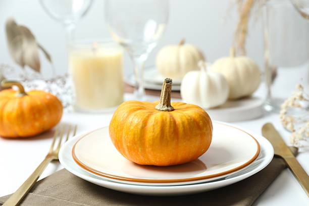 istock Rustic holiday table setup with plates, cutlery and autumn decorations 2252152285