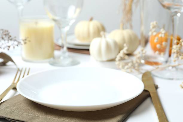 istock Rustic holiday table setup with plates, cutlery and autumn decorations 2252152286