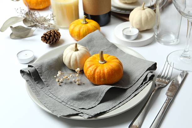 istock Rustic holiday table setup with plates, cutlery and autumn decorations 2252152288