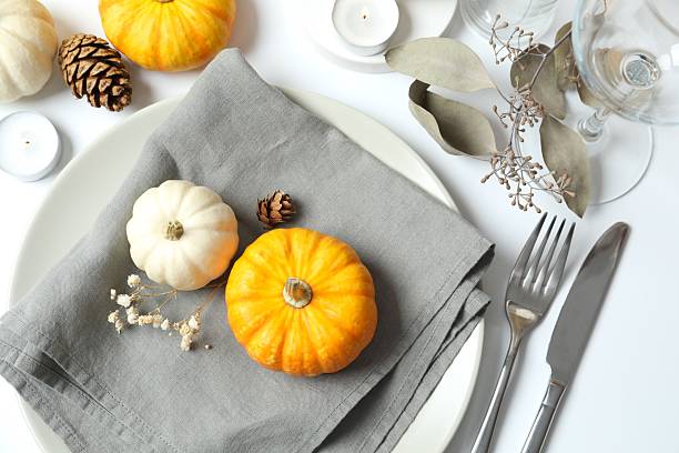 istock Rustic holiday table setup with plates, cutlery and autumn decorations 2252152290