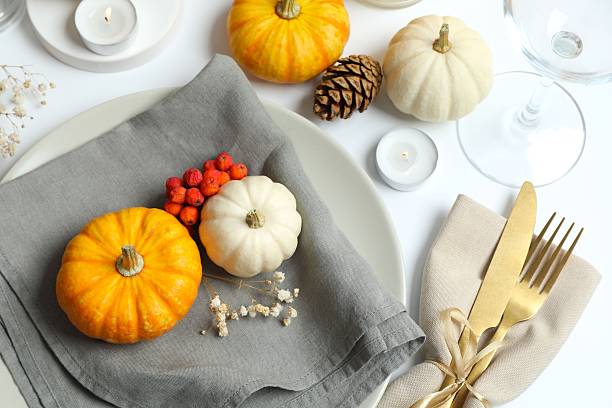 istock Rustic holiday table setup with plates, cutlery and autumn decorations 2252152317