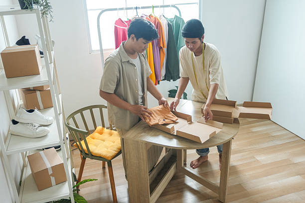 istock Dynamic Duo Preparing Online Orders for Shipping in Their Bright Home Workspace 2252153201