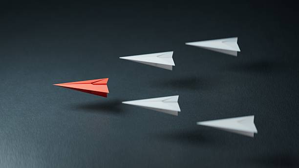 istock Different business concept.new ideas. paper art style. creative idea.Leaderplane concept, red paper plane leading among white.3D rendering on black background. 2252153301