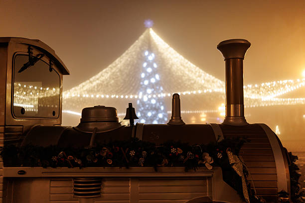 Christmas tree and lights at foggy night  in the city of Timisoara, Romania.