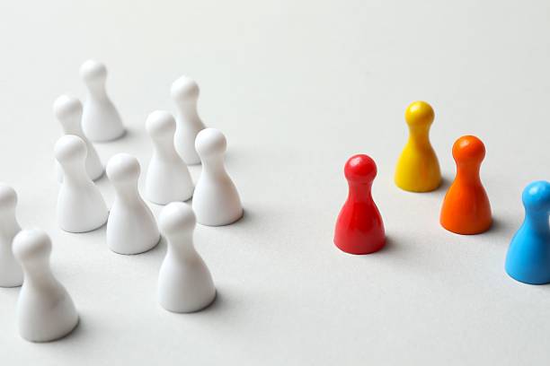 istock Group of pawns on the table. Concept of unity 2252158093