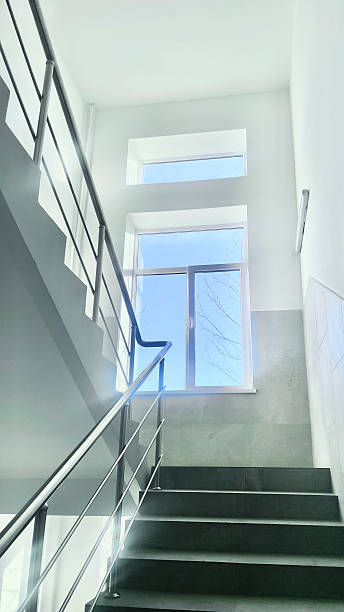 istock A spacious stairwell features a large window that brightens the area with sunlight 2252159585