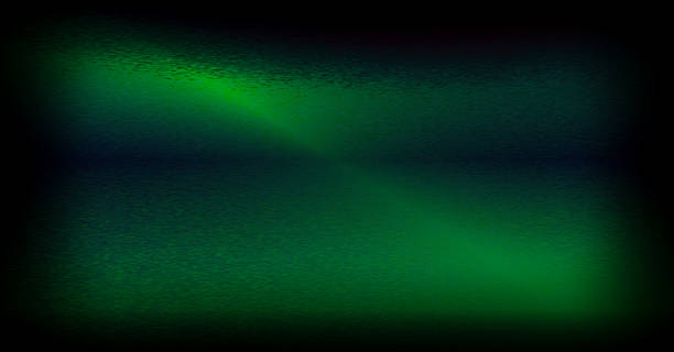 istock Striking symmetrical green light beam diagonally cutting through a dark, textured background. Mood-setting abstract design. 2252161310