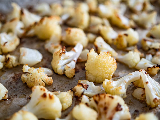 istock Baking tray with pieces of prepared cauliflower 2252161812