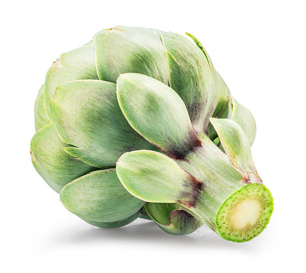 Green artichoke flower edible buds in a wooden bowl isolated on a white background.