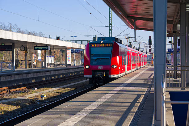 Red Rhein Main S-Bahn train at railway station Frankfurt am Main Stadion on an autumn day. Photo taken November 22nd, 2025, Frankfurt am Main, Germany.