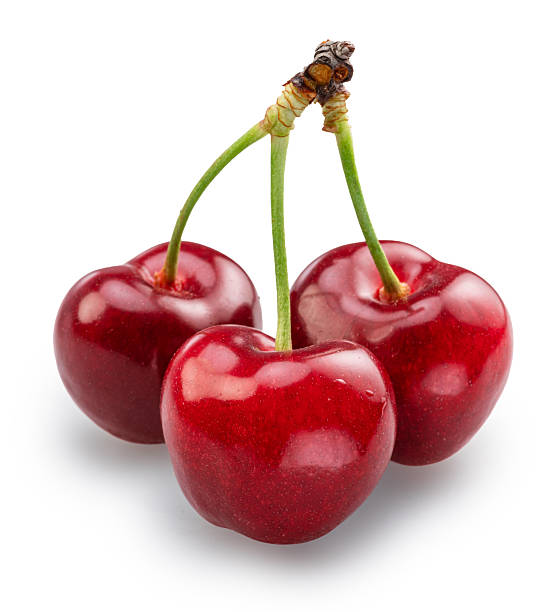 Three sweet cherries isolated on white background. File contains clipping paths.