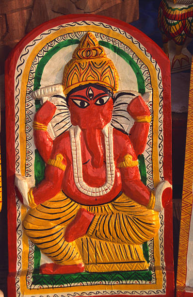 Lord Ganesha is the elephant-headed Hindu deity of wisdom, intellect, and new beginnings, worshipped as the remover of obstacles (Vighnaharta) before any major undertaking, known as the son of Shiva and Parvati. He symbolizes the primal sound Om (AUM), represents the Muladhara Chakra (root energy), and is often depicted with a pot belly, a modaka sweet, an ankusha (goad), and a pasha (noose). His distinctive elephant head signifies wisdom and understanding, and his vehicle is the rat, symbolizing his ability to overcome any challenge.