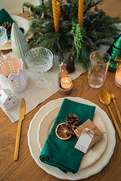 istock Festive table setting. Homemade Christmas with decor. Gift box, burning candles. New Year. 2252165653