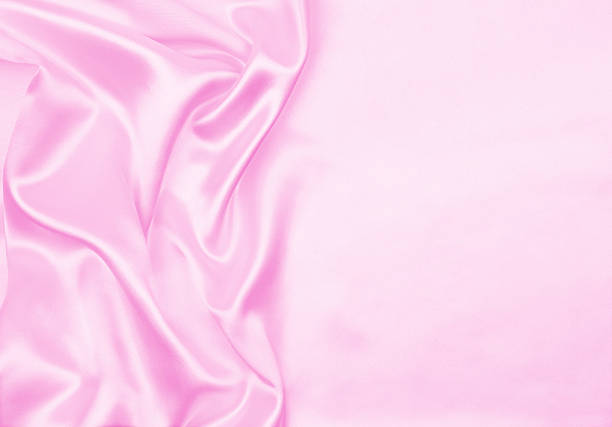 istock Smooth elegant pink silk or satin texture as wedding background. Luxurious valentine day background design 2252167309