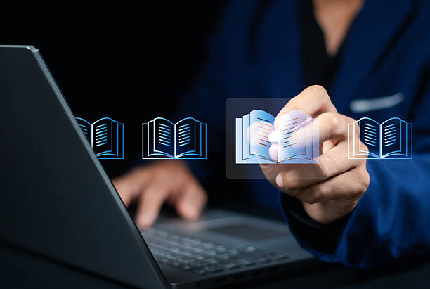 istock E-library and E-learning Concept, Person using laptop with virtual E-Book icons for online knowledge Base, Digital library, Access electronic books on Internet. Course education. Webinar technology. 2252168647