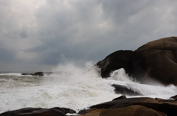 istock Waves and giant squid-shaped rocks 2252169297