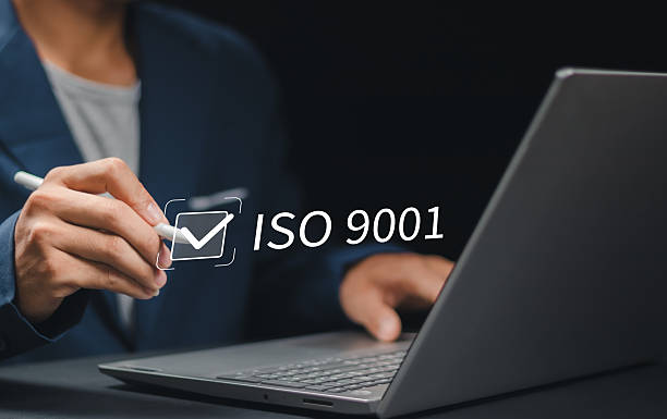 istock ISO 9001 Standard certification standardisation quality control concept. Person use laptop and choose ISO 9001 on virtual screen for certified and quality management of organizations 2252169351