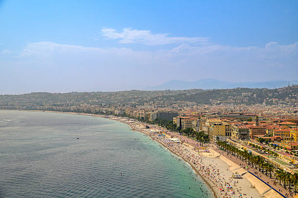 View on Nice over the Promenade des Anglais along the Mediterranean coast from Castle Hil (Colline du Ch�teau), France during a summer day. Located on the French Riviera, the southeastern coast of France on the Mediterranean Sea, at the foot of the French Alps, Nice is the second-largest French city on the Mediterranean coast and second-largest city in the Provence-Alpes-C�te d'Azur region