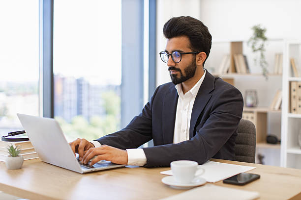 istock Indian Businessman Working on Laptop 2252172960