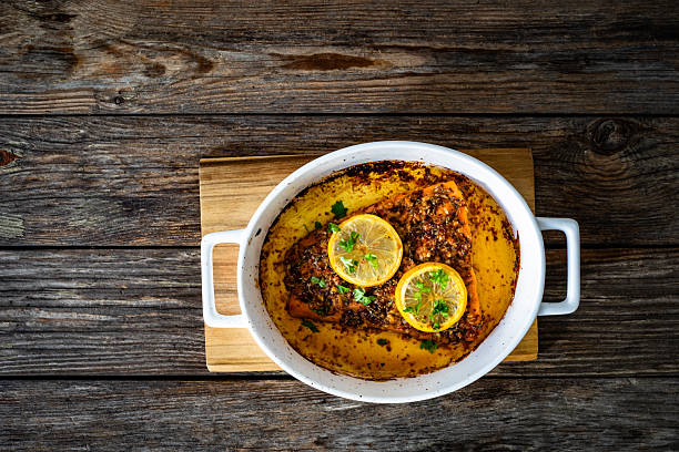 Roasted salmon steak on wooden table