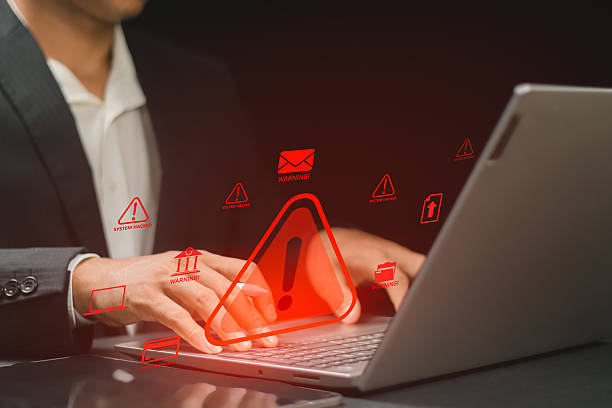 istock Cybersecurity concept showing warning alert on laptop screen, symbolizing data breach, hacking attack, and online threats in digital business environment. 2252173343