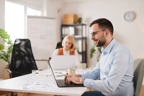 istock Business team collaborates on project in a bright office space while brainstorming ideas for success 2252175705