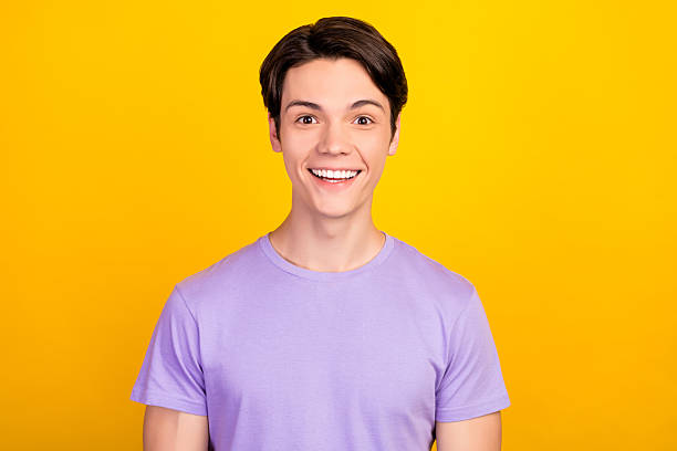 Portrait of attractive cheerful dreamy guy thinking copy empty space isolated over bright yellow color background