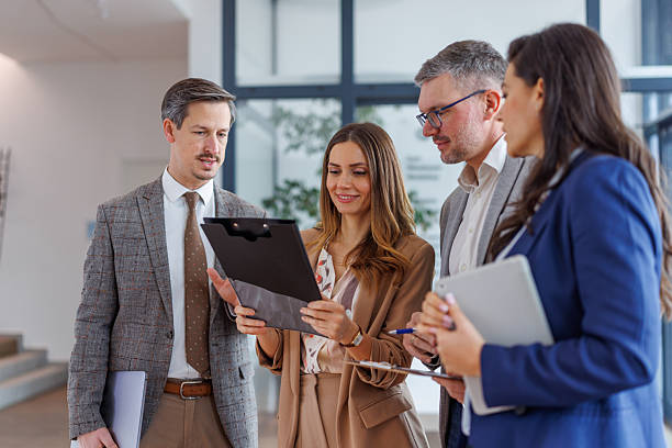 istock Business professionals collaborating at modern office discussing documents 2252181213