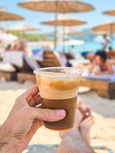 Drinking freddo espresso on the beach in Greece