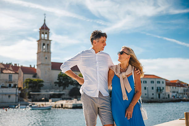 istock Mature Couple Exploring Adriatic Town with Joyful Expressions 2252184078
