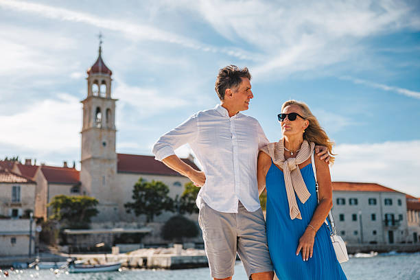 istock Caucasian Couple Relaxing by Historic Sutivan Waterfront 2252184081