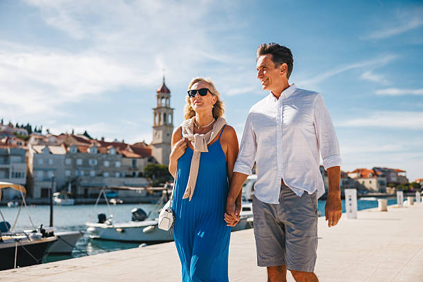 istock Smiling Mature Caucasian Couple Strolling by Adriatic Waterfront 2252184260