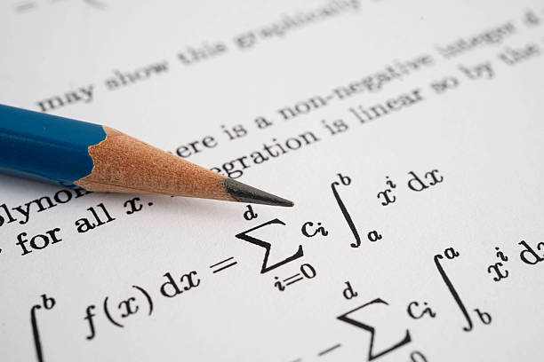Pencil on mathematic formula exercise test paper in education school.