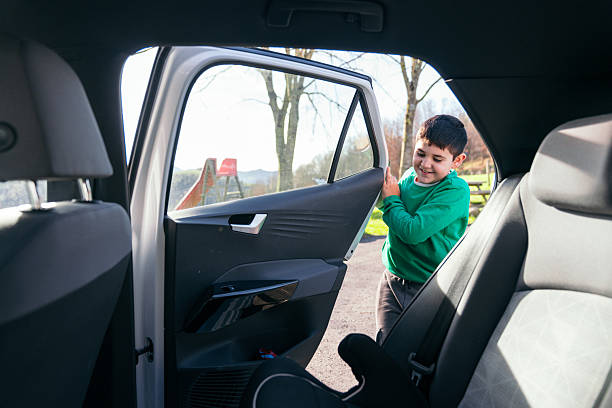 istock Happy boy getting out car at playground 2252185664