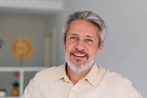 istock Mature man smiling looking away indoors 2252187324
