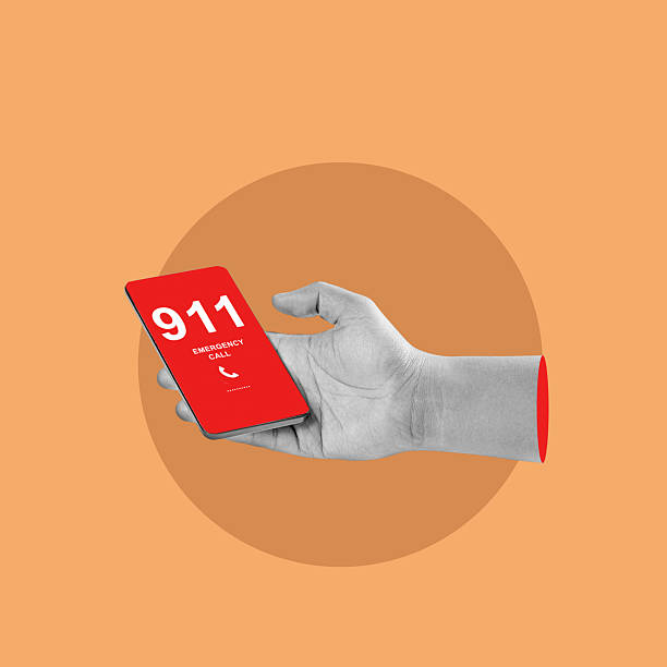 istock Hand holding a cellphone displaying the emergency number 911 on a red screen. Collage art. Concept of Emergency Service 2252190593