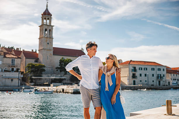 istock Mature Caucasian Pair Enjoying Adriatic Coastal Walk in Sunlight 2252191110