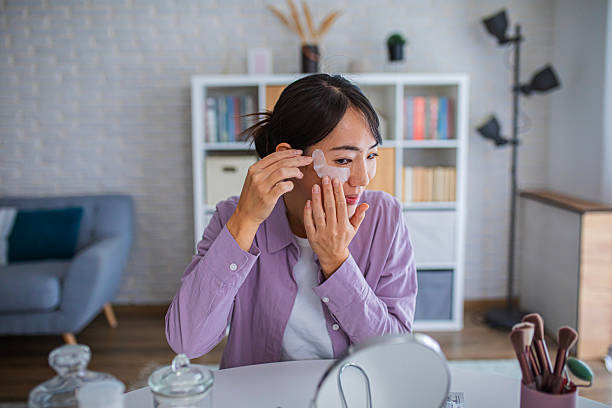 istock Woman Applying Under-Eye Patches During Skincare Routine 2252191645