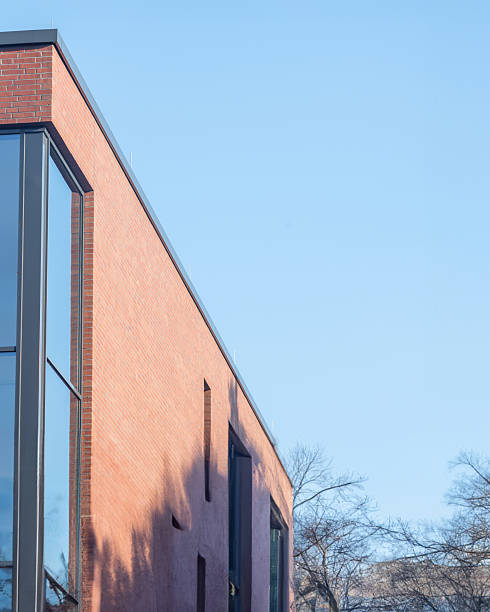 istock Modern brick building under clear blue sky with trees in the background during daytime 2252191757