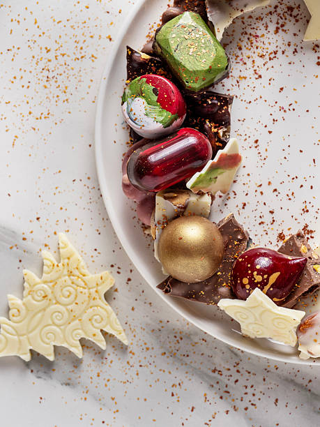 Assorted Handmade Chocolates on White Plate, New Year Gift and Holiday Dessert Concept