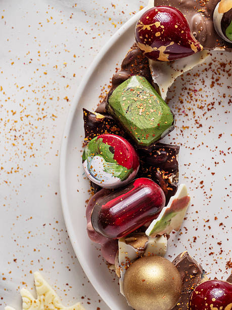 Assorted Handmade Chocolates on White Plate, New Year Gift and Holiday Dessert Concept