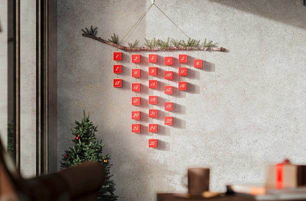 13-24 part of Advent calendar with numbers on white sheets on decorative clips on white-red snowy background. Xmas festive decorations.