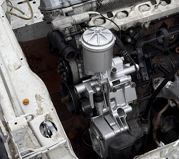 istock Silver water pump visible in an engine compartment of a car, revealing mechanical details 2252197188